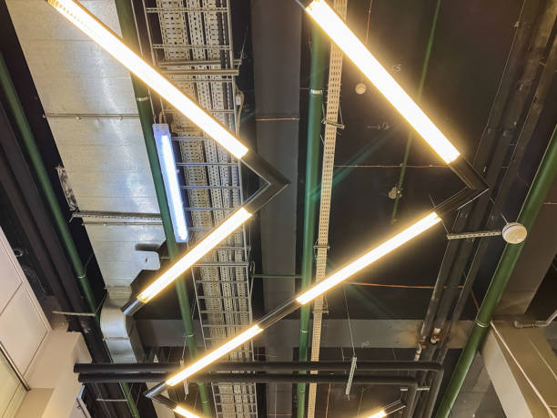 A ceiling that features an abundance of lights hanging down from it, creating a welllit ambiance and illuminating the space effectively, enhancing both functionality and aesthetics