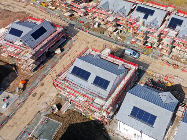 istock Solar panels installed on home roofs at new housing development 2194743873