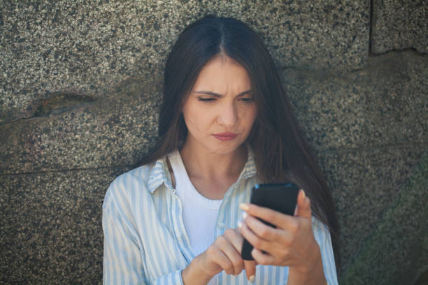 istock Young woman reading bad news 2194744377