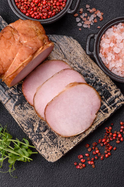 istock Meat, smoked, ham sliced with salt, spices and herbs 2194745778