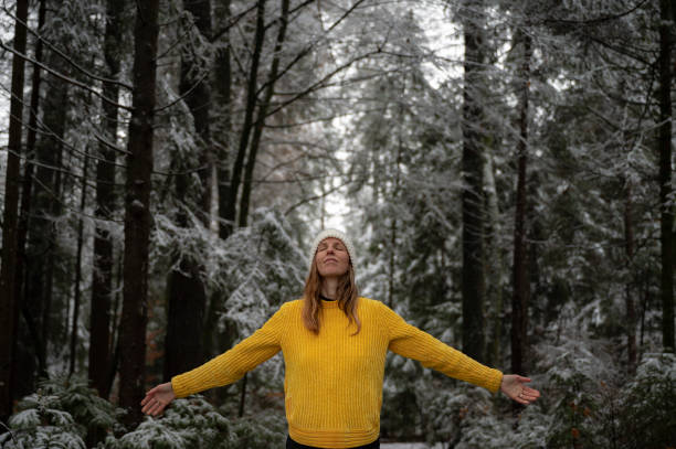 istock Young woman practicing mindfulness in winter forest 2194749944