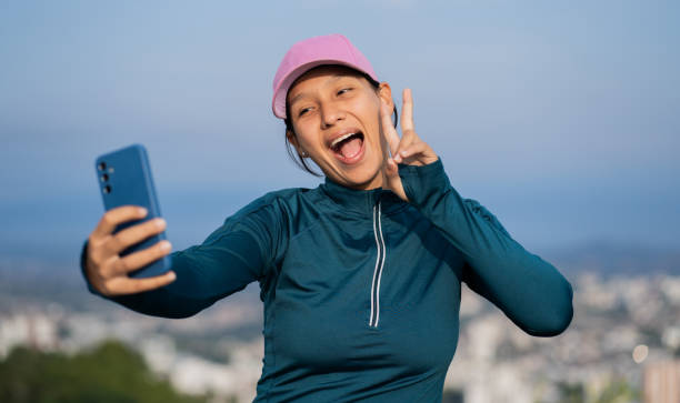 istock portrait of young walker taking selfie with joyful expression with cell phone 2194750800
