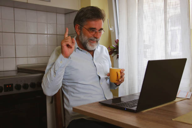 istock Senior man working online at home 2194751937