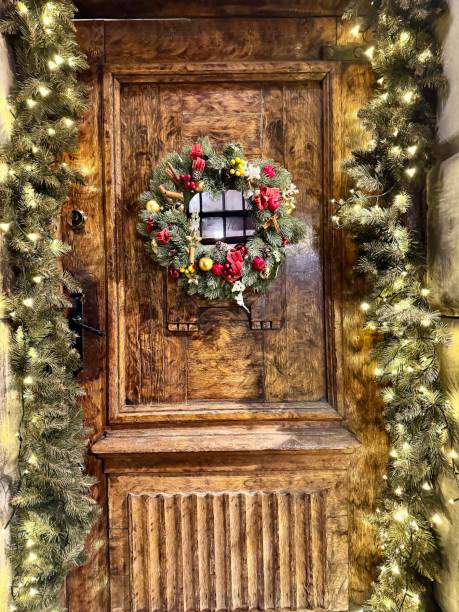istock wooden door with christmas decorations 2194752030