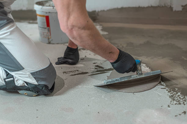 istock A worker's hand using a trowel for applies a  liquid membrane on the bathroom floor. Foolproof waterproofing for a tile bathroom. 2194752125