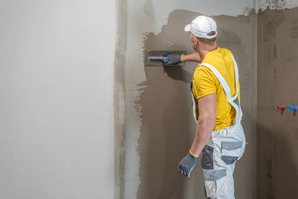 istock A worker when applies a liquid membrane on shower wall before  bathroom tiling.   Foolproof waterproofing for a tile bathroom. 2194752558