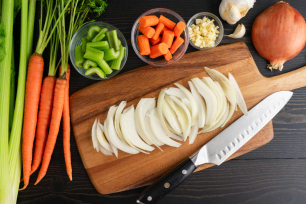 istock Sliced Yellow Onion on a Wooden Cutting Board 2194754257
