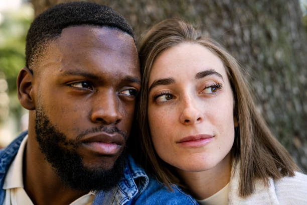 istock Multiethnic couple leaning heads together, sharing a moment of affection 2194757534