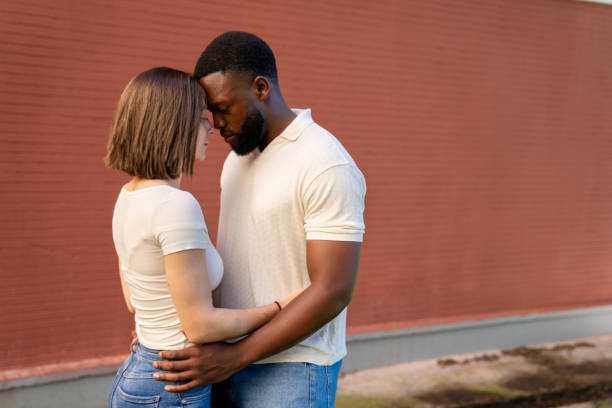 istock Multiethnic couple sharing a tender moment of affection 2194757664