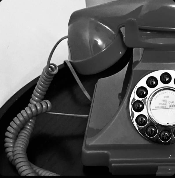 istock Half old red phone in black and white 2194759160