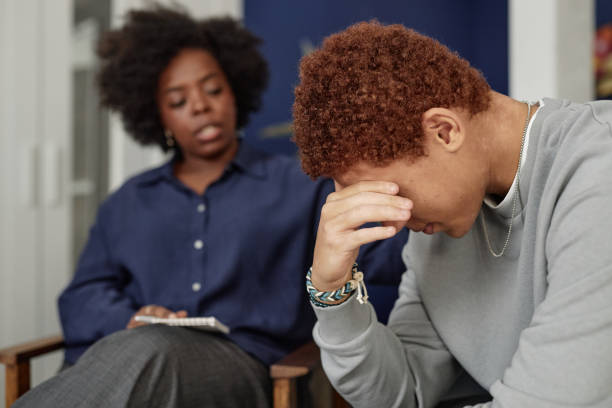 istock Black Teen Boy Crying in Support Group Meeting 2194759257