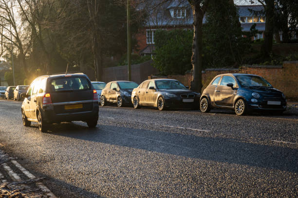 istock Frost snow covered british road and cars in england uk 2194760607