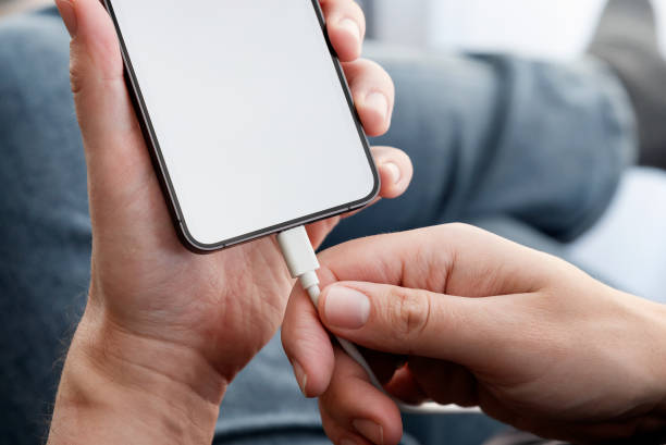 istock Man charging power to smart phone 2194761250