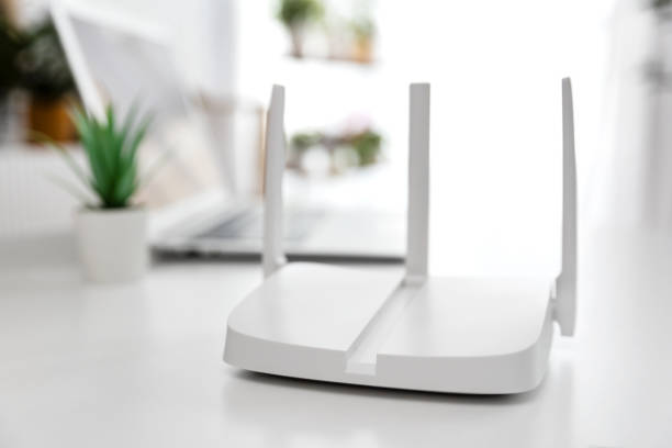 istock Modern wi-fi router on light table in room 2194761310