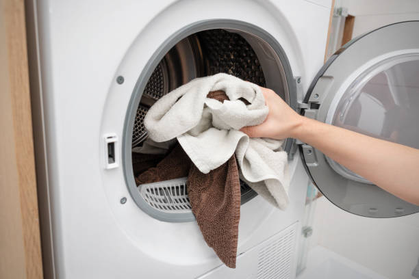 istock White washing machine in a utility room 2194761511