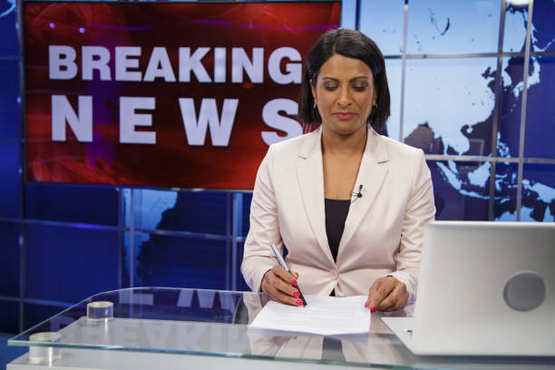 istock Breaking news female anchor 2194761738