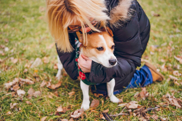 istock Woman cuddling her dog 2194761874