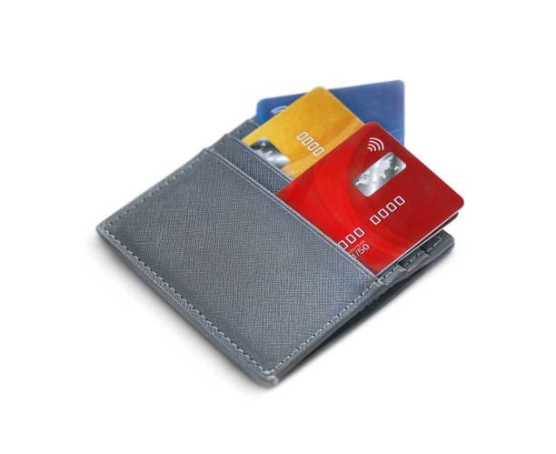 grey wallet with three multicolored bank cards is isolated on a white background