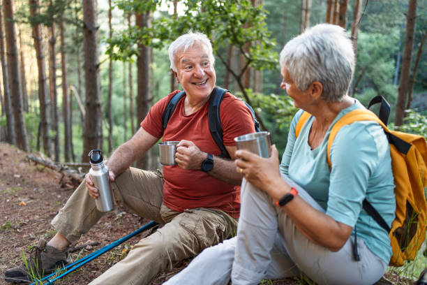 istock Senior couple of hikers taking a break 2194768134