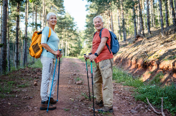 istock Senior couple hiking together in the forest 2194768151