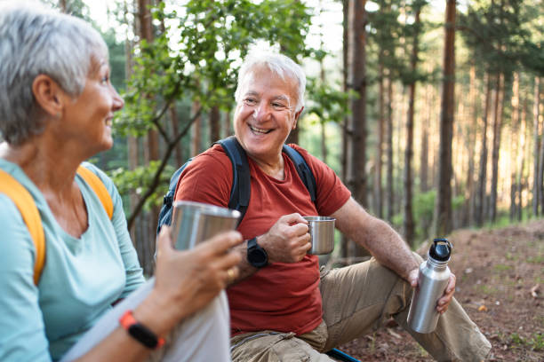istock Senior couple of hikers taking a break 2194768359