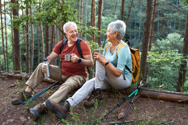 istock Senior couple of hikers taking a break 2194768405