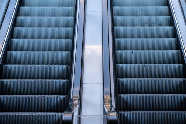 istock Two escalators at a shopping mall. 2194771789