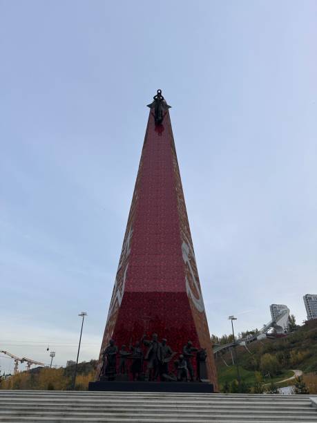 istock Tall red building with a statue of a man on top 2194772147
