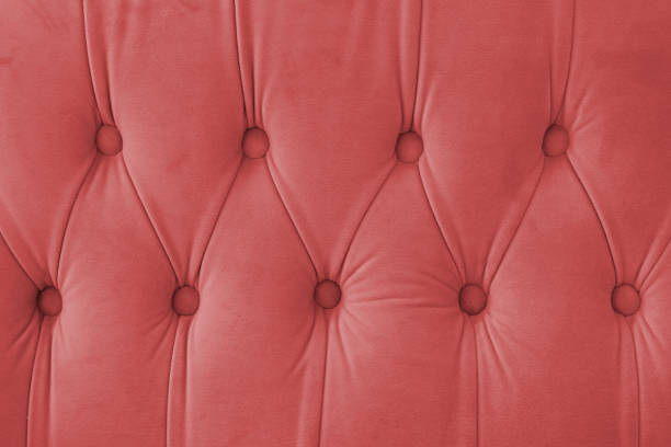 istock Capitone, Chesterfield style suede fabric texture, red diamond buttoned red background 2194780596