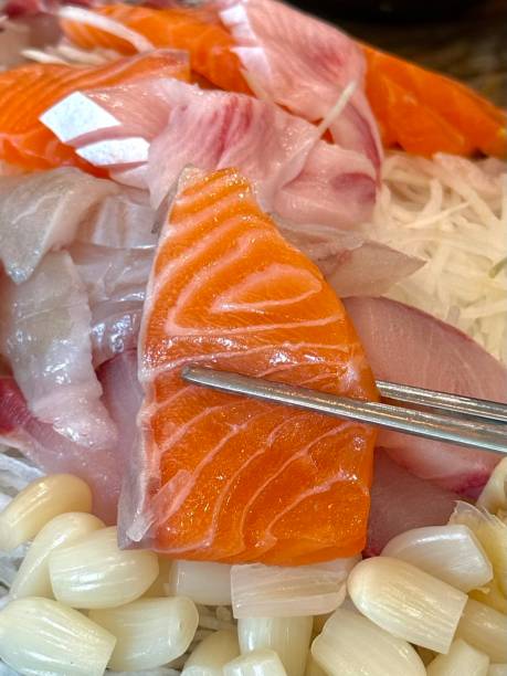 istock Sashimi, a Japanese delicacy featuring thinly sliced raw fish, served fresh and beautifully arranged for a pure and flavorful experience. 2194789521