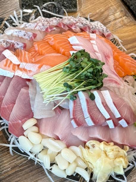 istock Sashimi, a Japanese delicacy featuring thinly sliced raw fish, served fresh and beautifully arranged for a pure and flavorful experience. 2194789899
