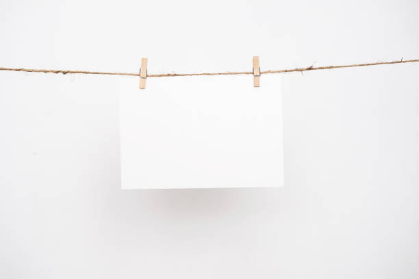istock Blank note paper hanging with wooden clips. 2194790851