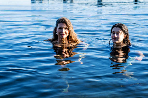istock Two Women Partake in a Invigorating Healthy Cold Plunge 2194791592