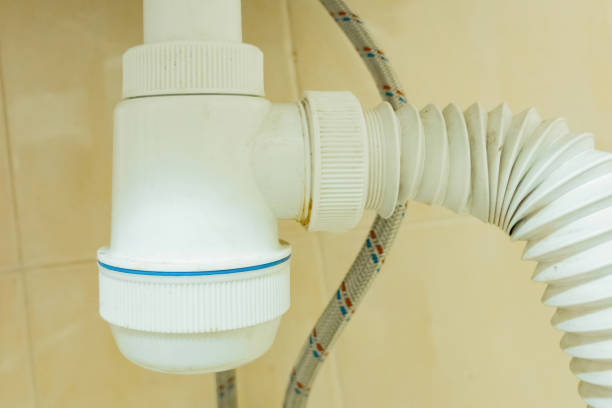 istock White plastic siphon with a foldable pipe in a bathroom. Handyman. Installing. Leak. Professional. Service. Flexible. Tubing. Work. Cleaning. Apartment. Connection. Contractor. Damage. Install. Pvc 2194792799