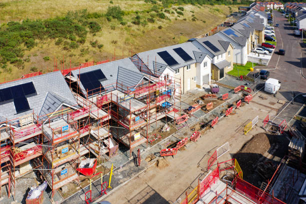 istock Solar panels installed on home roofs at new housing development 2194794127