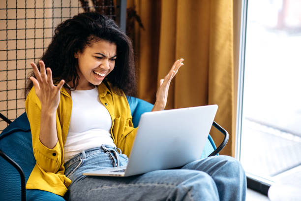 istock Confused young business woman is having problem with internet connection while video conference with coworkers. Worried female student or employee got a bad news 2194794397
