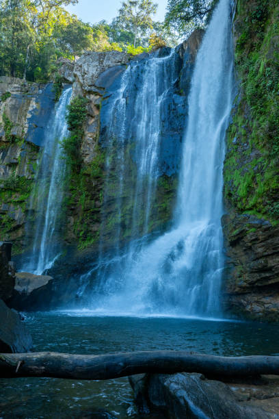 istock Majestic Waterfall Cascading over Lush Cliffside in Tranquil Forest 2194797382