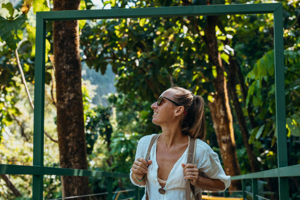 istock Woman Hiking on Jungle Bridge with Backpack 2194797429