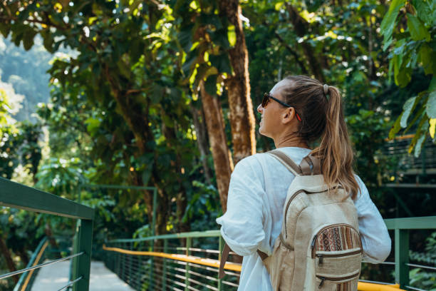 istock Woman Walking on Elevated Forest Trail with Backpack 2194797479