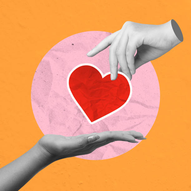 istock A human hand gives a red heart to others on a colored background 2194802719