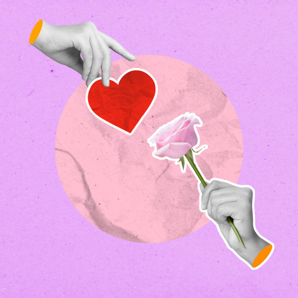 istock A human hand holding a pink rose flower and a red heart on a colored background 2194802817