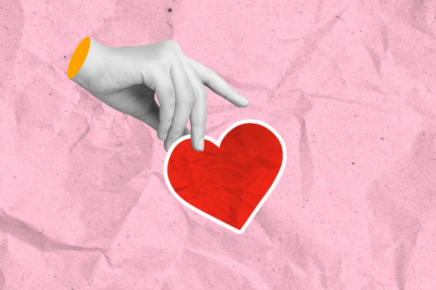 istock A human hand holding a red heart on a colored background 2194802853