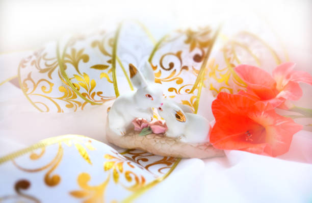 Easter bunny, beautiful home decoratoins. Spring fresh flowers and pastel colors background.Morning sunlight. Easter Card. Happy Easter