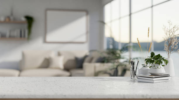 istock A white tabletop with a blurred background of a minimalist white living room. 2194803366