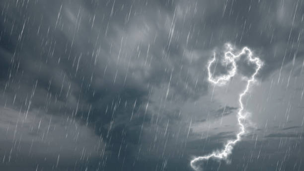 istock Scene of rain and thunders striking from dark clouds with an overcast background. Concepts of extreme weather, climate change, or global warming 2194806182