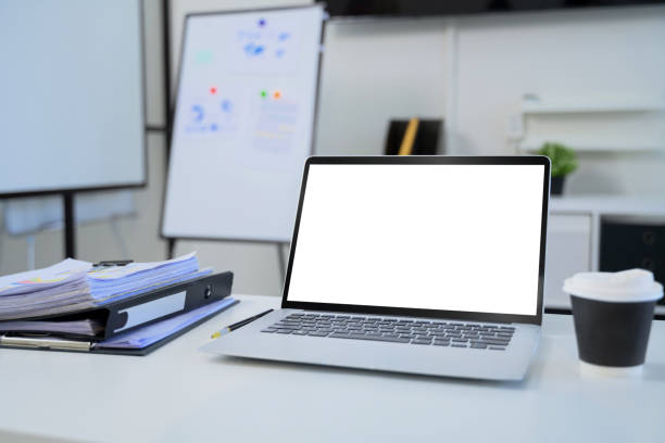 istock Laptop with empty screen, stack of folders, and a coffee cup in a modern workspace 2194806469