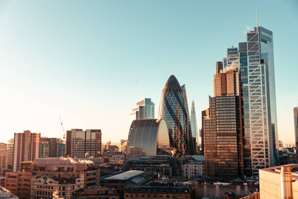 istock Wide angle of sun setting over London Gherkin 2194809561