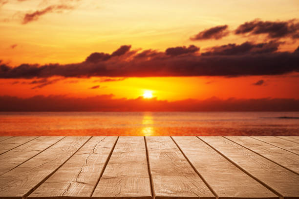 istock Empty wooden table top with tropical ocean sunset background 2194811044