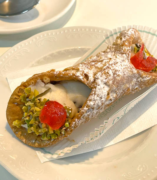 istock Canoli with pistachios on saucer. 2194811565