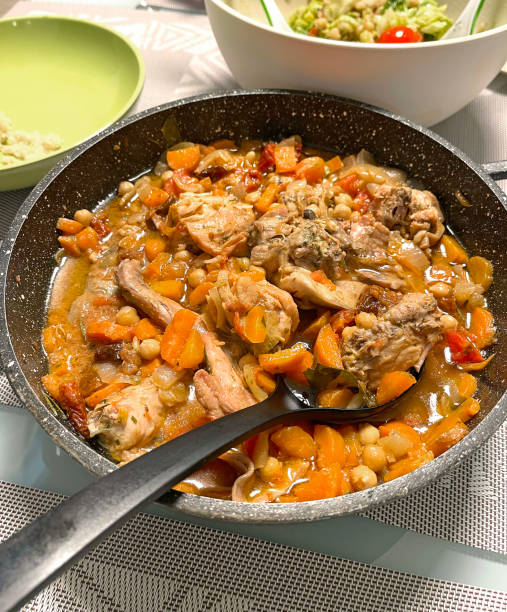 istock Stewed rabbit with vegetables in a skillet. 2194811570